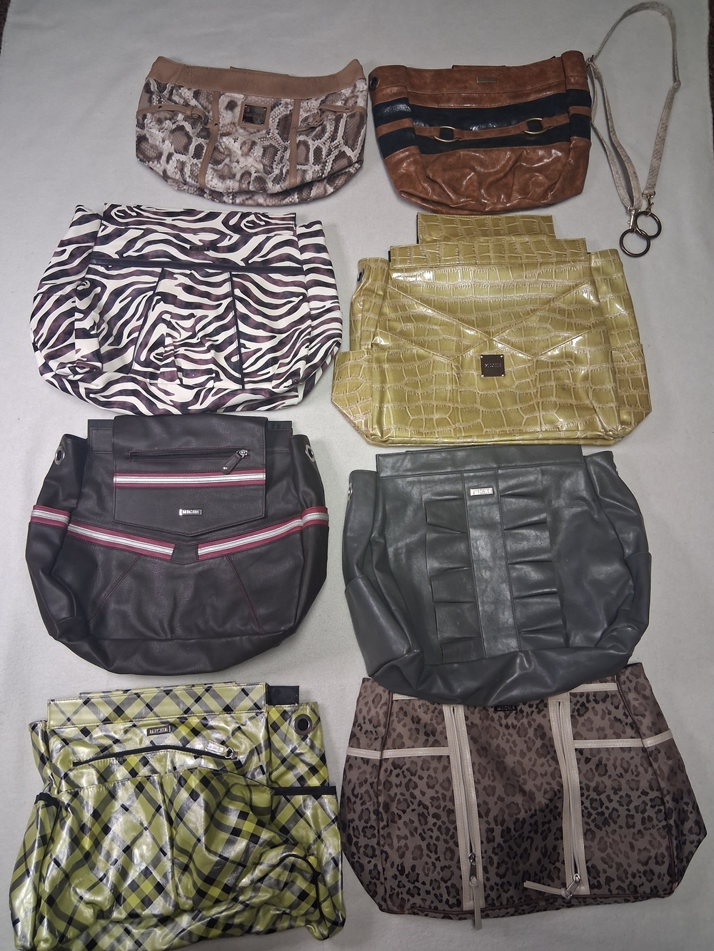 This is a collection of Miche interchangeable purse shells 1 Strap